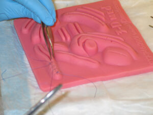 rubber square to practice suturing