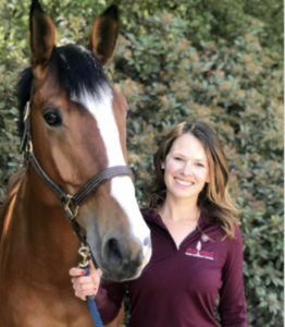 Dr. Brigid McCarthy next to a horse